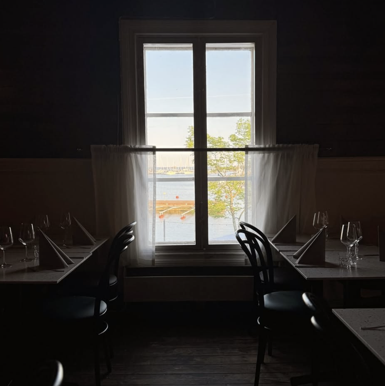 Dining room view toward the harbor at Rökstugan
