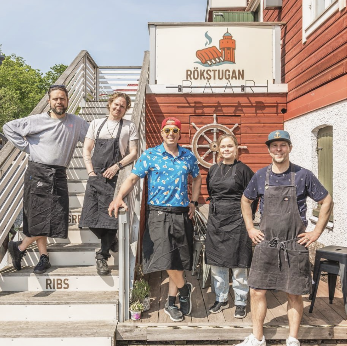 Rökstugan team standing outside by the entrance