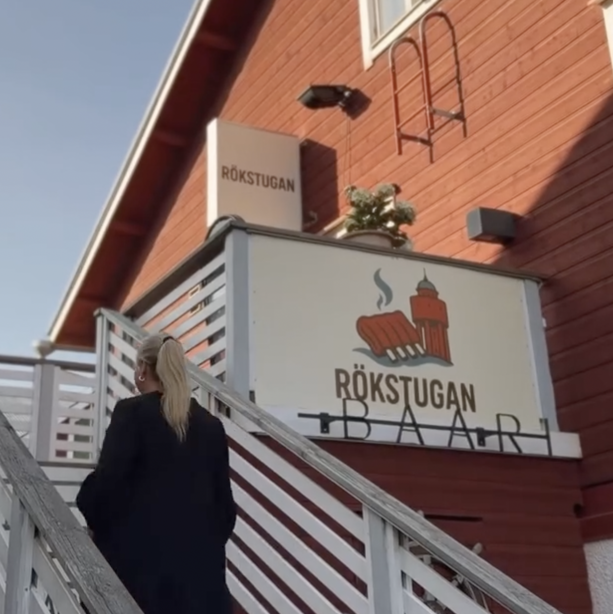 Rökstugan bar sign viewed from the stairs